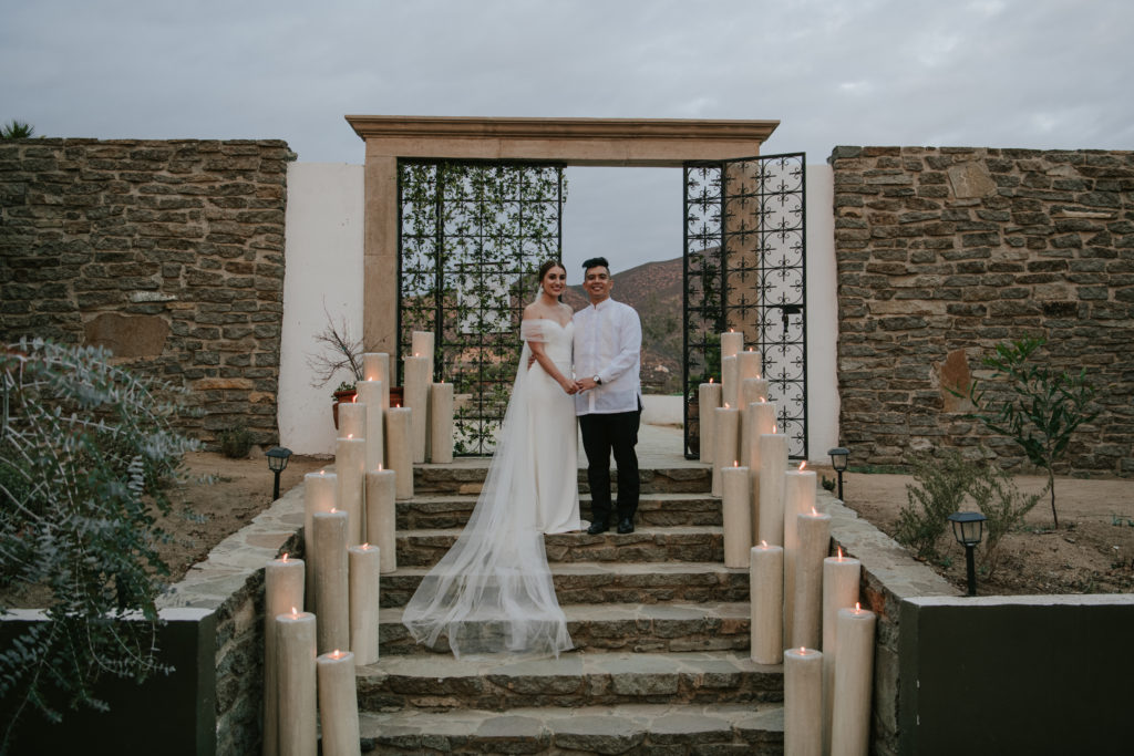 bride and groom posing at destination wedding in mexico